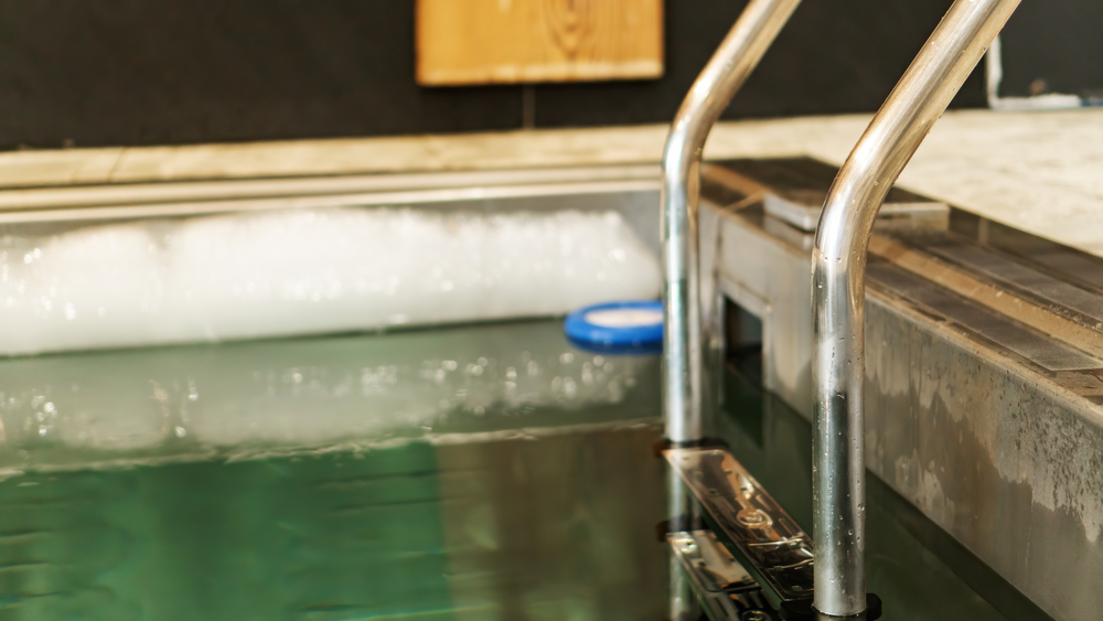 Ladder,with,handrails,leading,to,the,pool,with,ice,cold