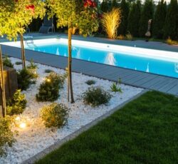 Scenic,residential,outdoor,swimming,pool,illuminated,by,led,lighting.,poolside